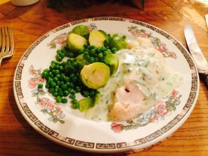 Cod fillet with white sauce.