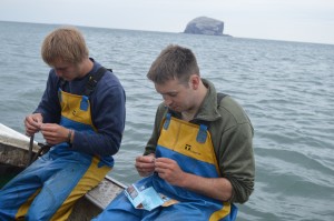 The lads having a break by the Bass Rock. 