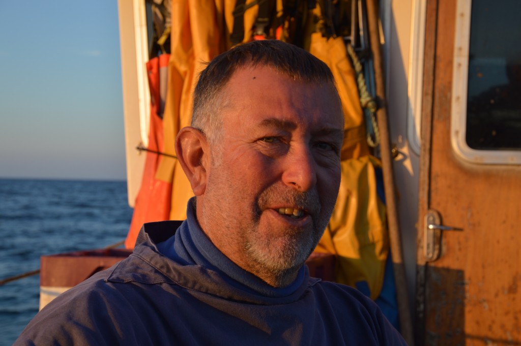 Nick Hutchings sailing out of Dartmouth at sunrise to net rays. 