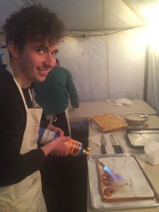 Asher burning the brûlée (I think you're meant to)