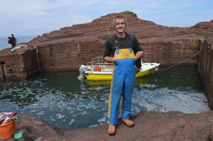 Second hitch a ride on a fishing boat. Sam Lowe works for Jack Dale as a lobster fisherman off Seacliff Harbour, one of the smallest working harbours in Britain. 